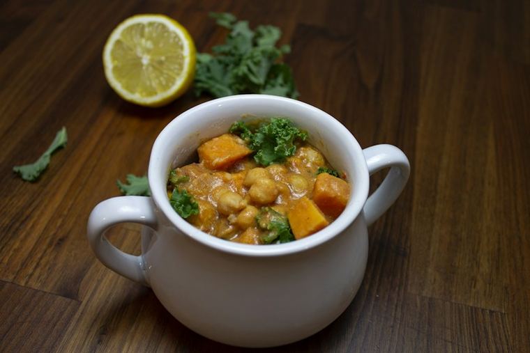 Warm lentil and herb comfort bowl with sweet potato and kale