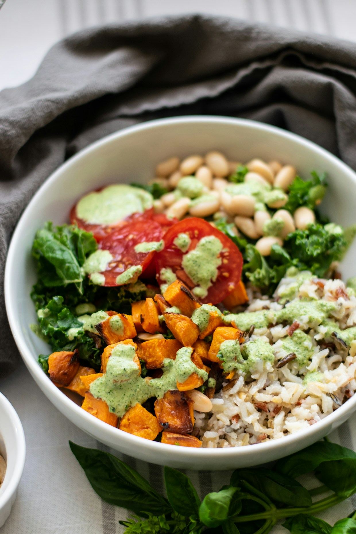Golden turmeric wellness bowl with roasted sweet potato and greens